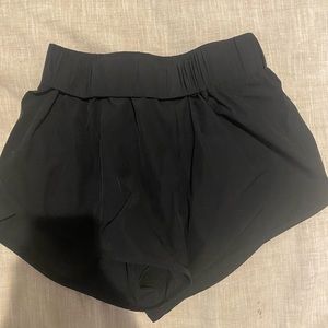 black halara dolphin fit shorts, size small